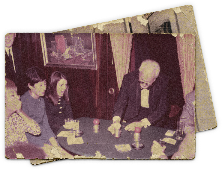 Photograph of legendary magician Dai Vernon performing in The Close-Up Gallery of The Magic Castle.